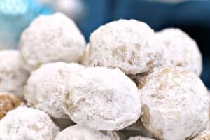 Photo of Pecan Snowball Cookies with text overlay for Pinterest