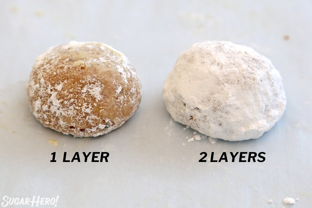 Two snowball cookies, one with a single coating of powdered sugar, one with a double coating.