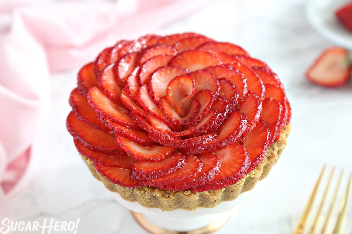 Close-up of a Strawberry Rose Tart with a pink napkin in the background.