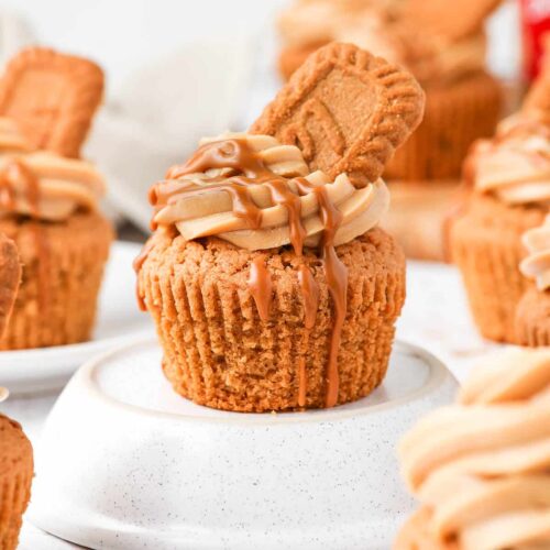Close up of a Biscoff Cupcake on an overturned white bowl.