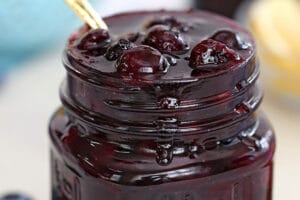 Pinterest collage showing a glass jar of blueberry sauce with text that reads "blueberry sauce".