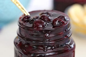 Pinterest collage showing a glass jar full of blueberry sauce with text overlay that reads "Blueberry Sauce".