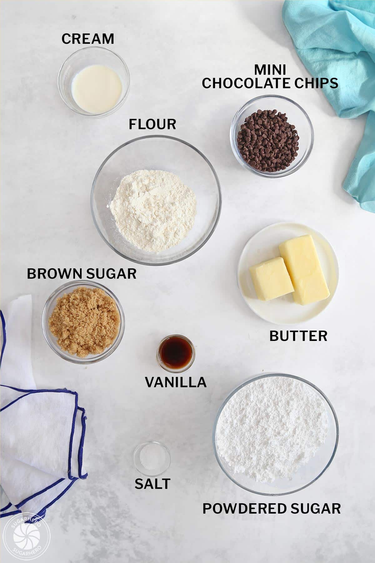 Ingredients for cookie dough frosting measure out in separate glass bowls.