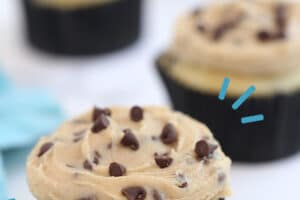 Photo of cupcake frosted with Cookie Dough Frosting with text overlay for Pinterest.