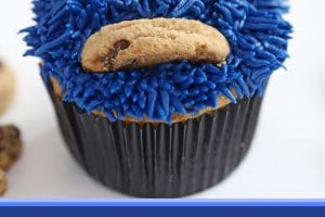 Photo of Cookie Monster Cupcakes with text overlay for Pinterest.