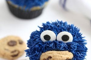 Photo of Cookie Monster Cupcakes with text overlay for Pinterest.