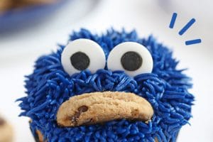 Photo of Cookie Monster Cupcakes with text overlay for Pinterest.