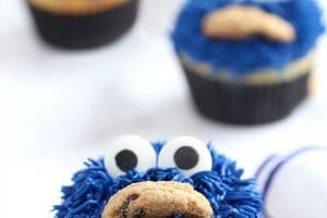 Photo of Cookie Monster Cupcakes with text overlay for Pinterest.