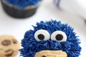 Photo of Cookie Monster Cupcakes with text overlay for Pinterest.