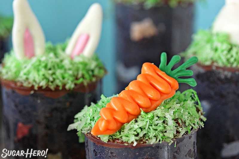 Close up of Easter push-up pop topped with a carrot made from candy melt.