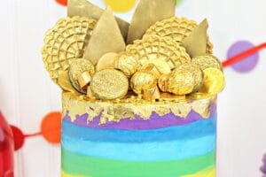 Photo of Gold-Topped Rainbow Cake with text overlay for Pinterest.