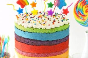 Photo of Rainbow Mousse Cake with text overlay for Pinterest.