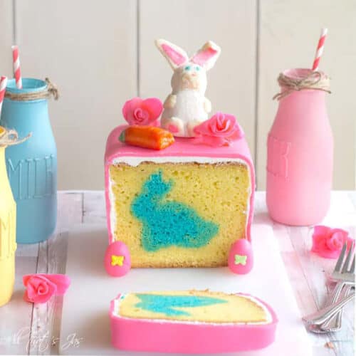 Pound cake covered with pink fondant with a blue bunny baked inside.