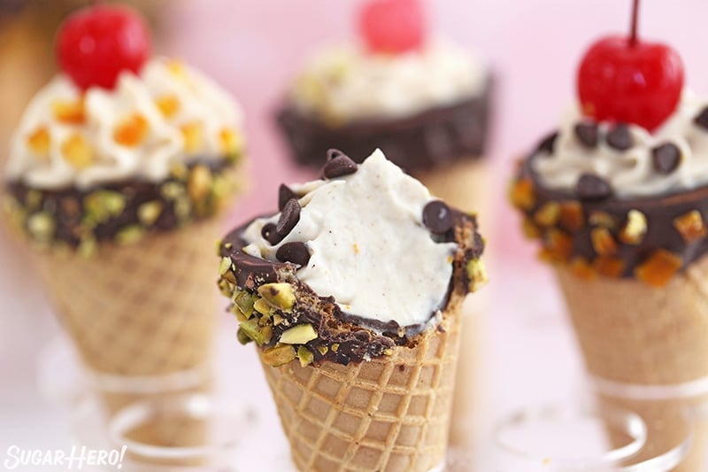 Close-up of cannoli cone with a bite taken out of it.