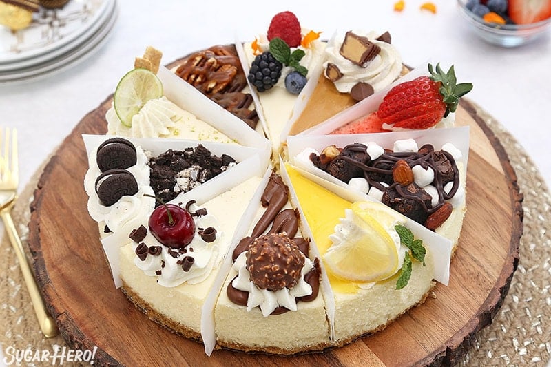 Cheesecake sampler with 10 different flavors on a wooden platter.