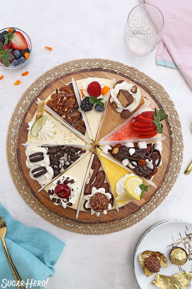 Overhead shot of a cheesecake sampler, showing the 10 different varieties of cheesecake in one cake.