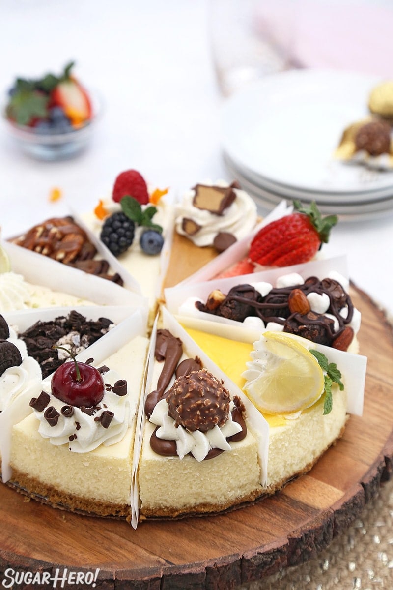 Cheesecake sampler with 10 different flavors on a wooden platter.