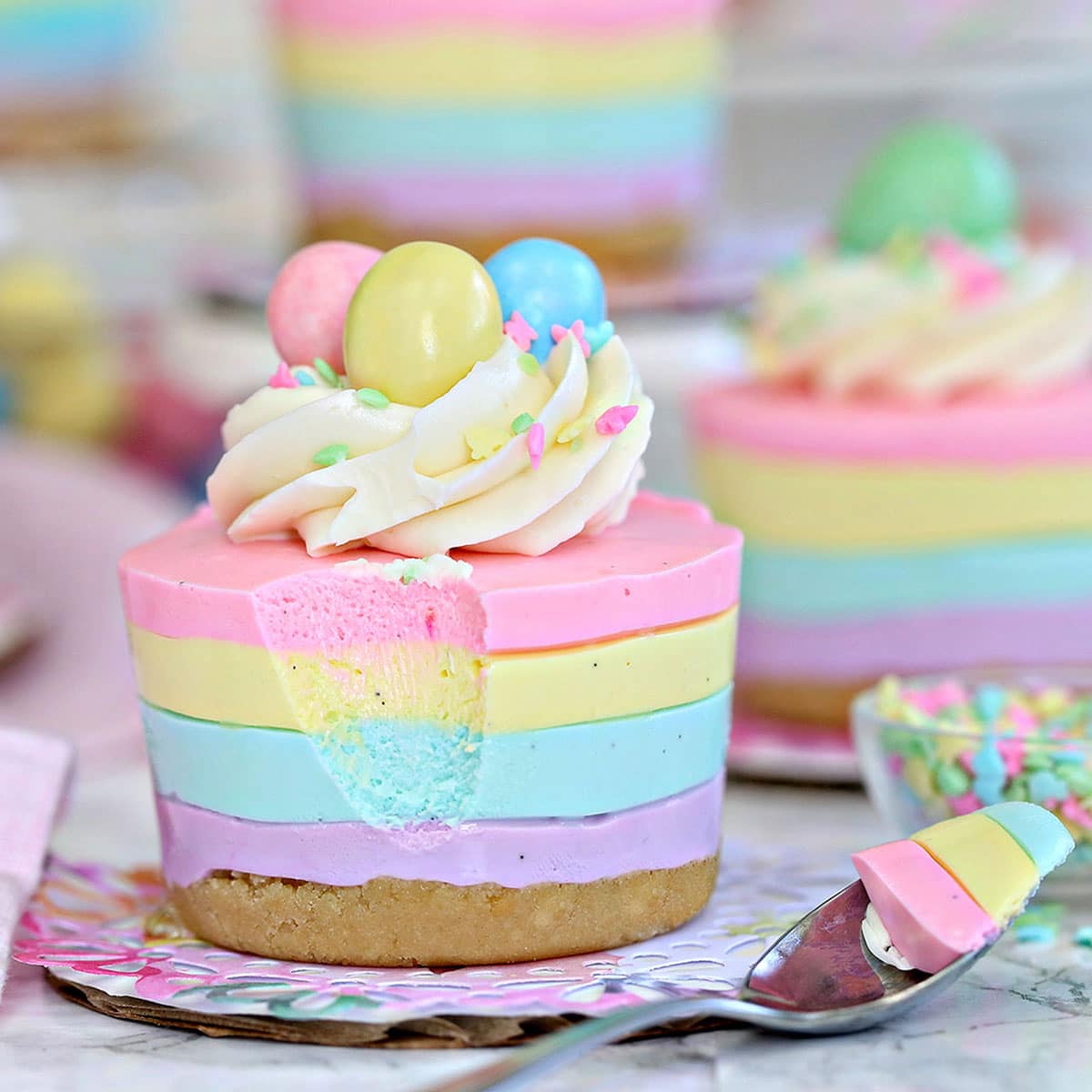 https://www.sugarhero.com/wp-content/uploads/2022/06/easter-no-bake-mini-cheesecakes-square-1200.jpg