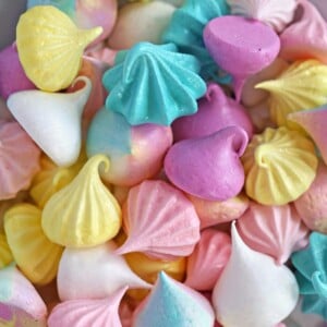 Colorful meringue cookies in assorted shapes and sizes.