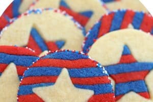 Photo of Stars and Stripes Sugar Cookies with text overlay for Pinterest.