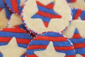 Photo of Stars and Stripes Sugar Cookies with text overlay for Pinterest.