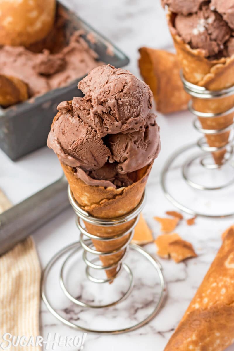 3 Scoops of No-Churn Chocolate Ice Cream in a waffle cone in a silver cone holder.