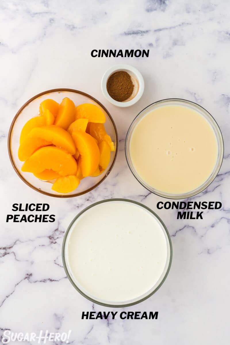 No-Churn Peach Ice Cream ingredients on a marble counter top.