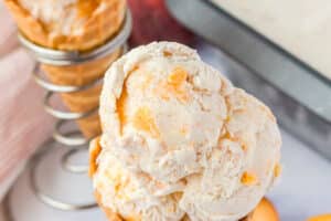 1 photo of No-Churn Peach Ice Cream with text overlay for Pinterest.