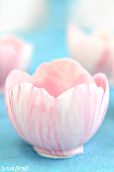 Close up of a pink and white Chocolate Bowl.