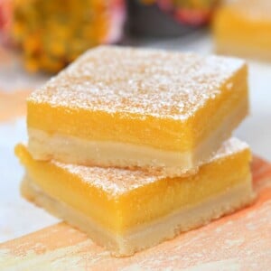 Stack of 2 Passion Fruit Bars sprinkled with powdered sugar.