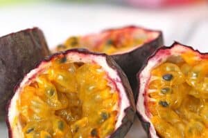 Photo of passion fruit cut open, with text overlay for Pinterest.