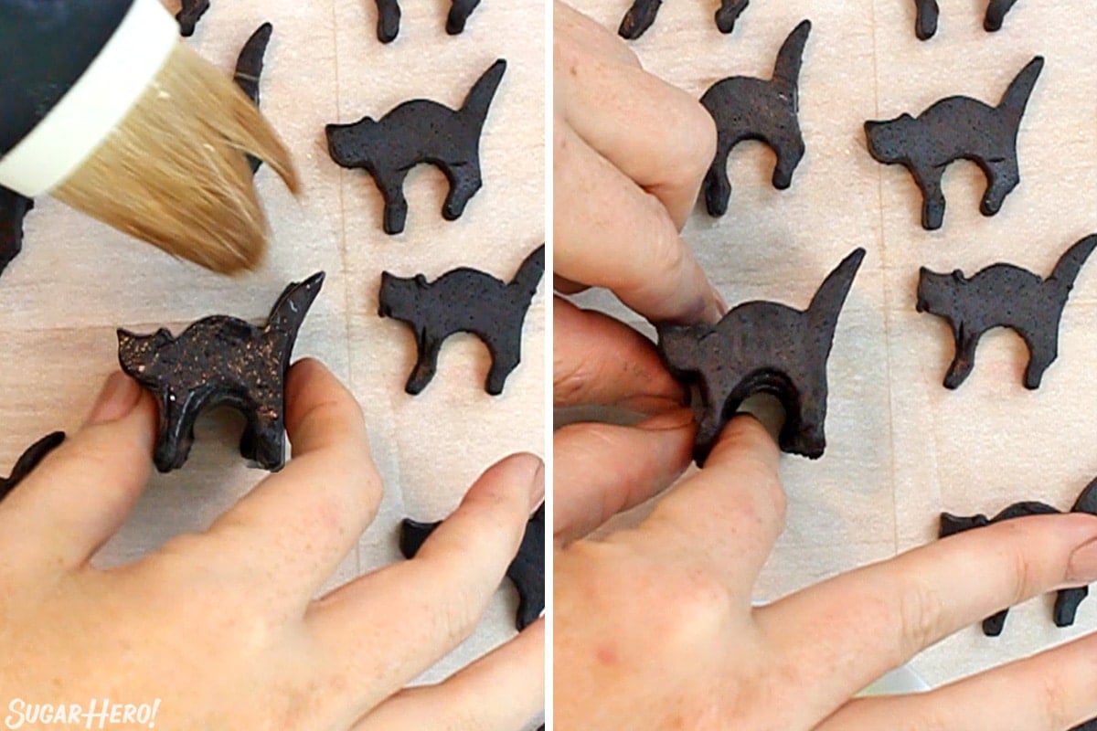 Frozen cat shaped dough being spread with egg white mixture and then pressed to another cat shape to form the interior of the Slice and Bake Halloween Cookie roll.