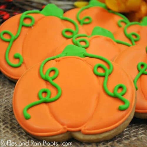 Cut-out sugar cookies decorated with royal icing to look like pumpkins.
