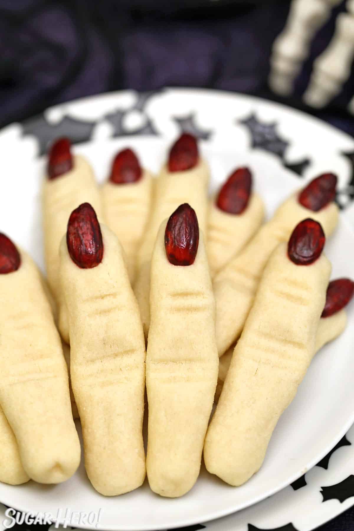Plate of Witch Finger Cookies with a black bat pattern on it.