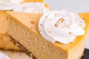 Photo of Pumpkin Spice Cheesecake with text overlay for Pinterest.