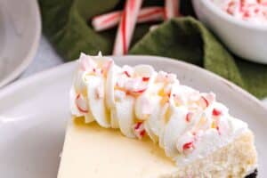 Picture of Candy Cane Cheesecake for with text overlay for Pinterest.