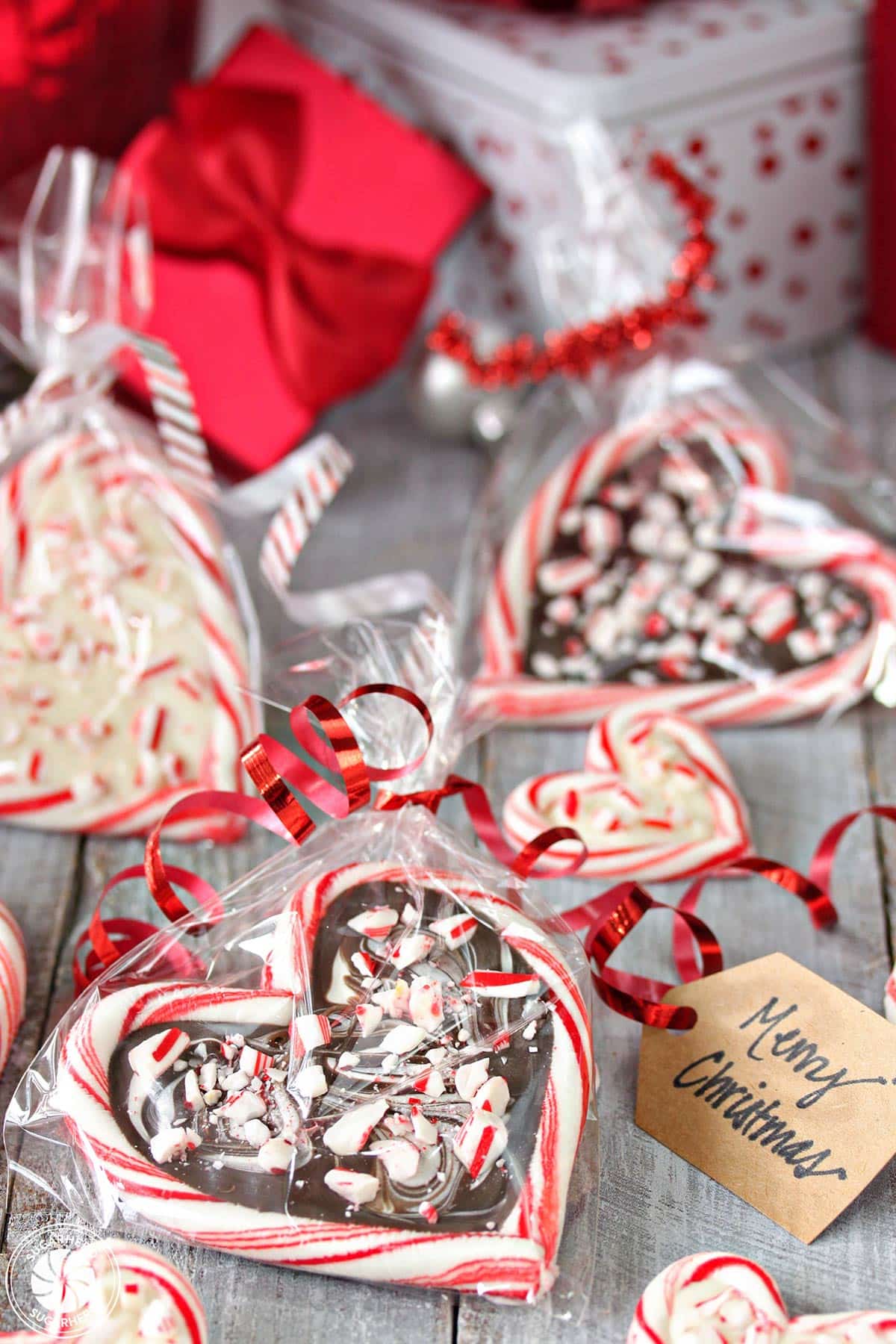 Candy Cane Hearts wrapped in cellophane, with ribbons and gift tags attached.