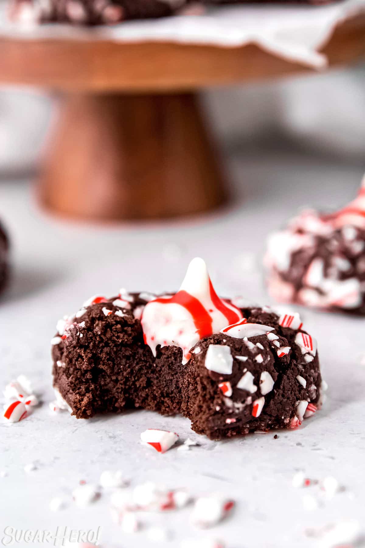 Close up of a Chocolate Peppermint Kiss Cookie with a bite taken out.
