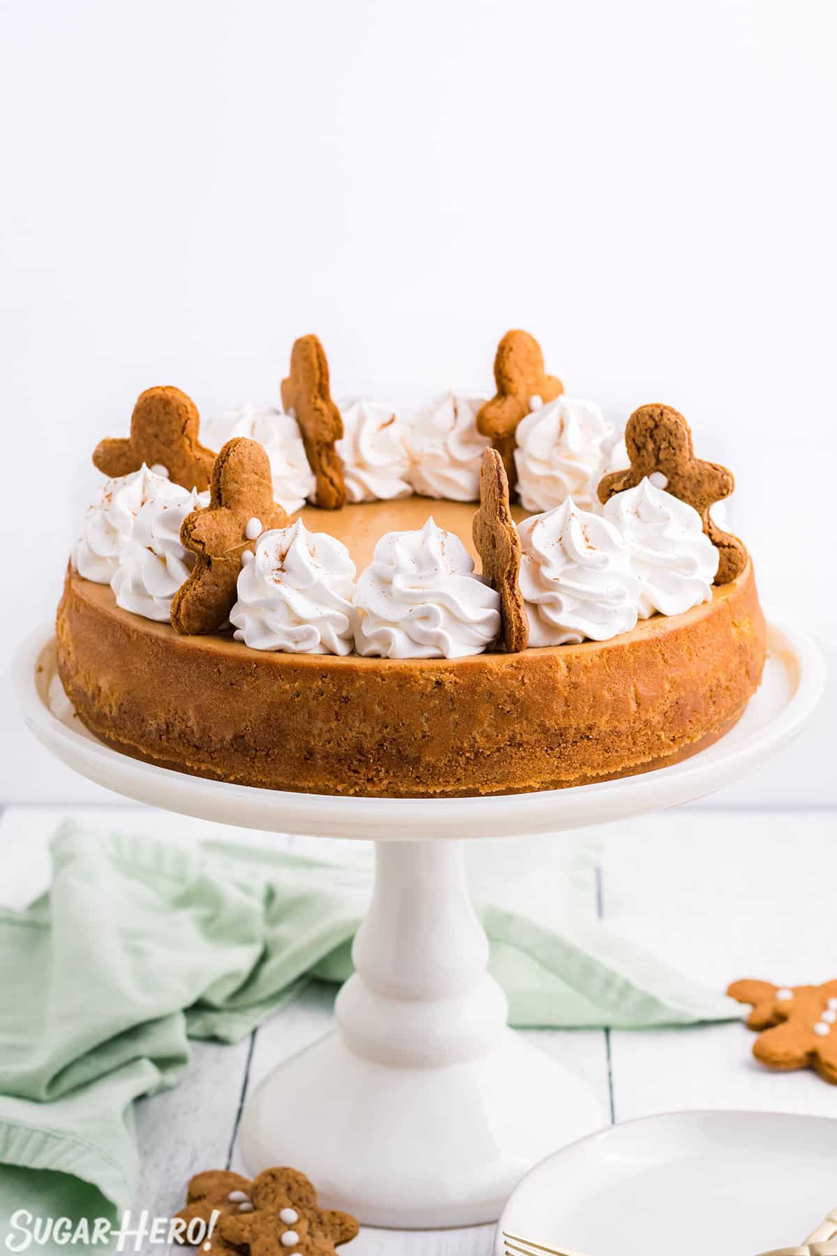 Gingerbread Cheesecake on a white cake plate.