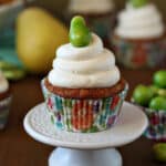 Close up of a Pear Cupcake with Honey Buttercream on a small white platter.