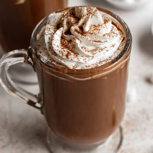 Mug of thick and creamy French Hot Chocolate on a marble surface.