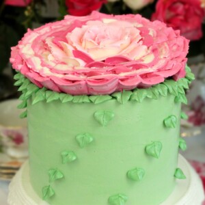 Giant Rose Cake on a white cake platter.