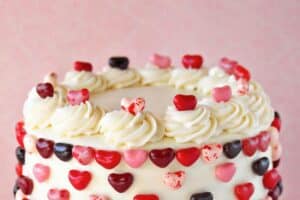 Photo of Pink and Red Velvet Cake with text overlay for Pinterest.