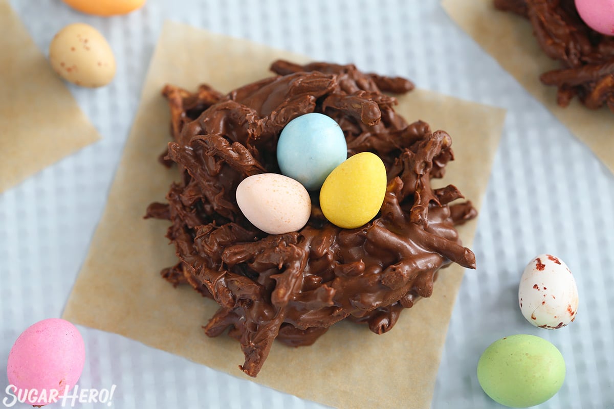 Close up of a Chocolate Easter Nest on a square of brown parchment.