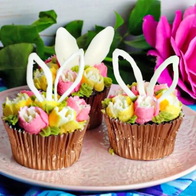 3 Floral Easter Bunny Ear Cupcakes on a pink plate for Easter Cupcake Round up.