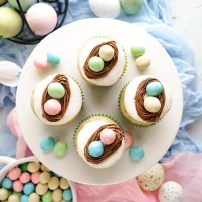 4 Vanilla Bean Easter Egg Cupcakes on a white plate for Easter Cupcake Round up.
