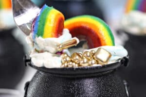 Photo of Pot of Gold Cake Cups with text overlay for Pinterest.