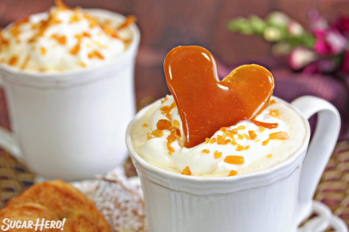 Creme Brulee White Hot Chocolate | From SugarHero.com Close up of the top of a mug of Crème Brulee White Hot Chocolate.