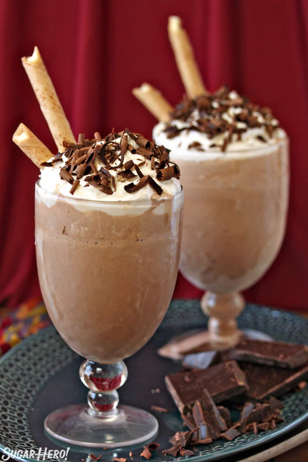 2 glasses of Frozen Hot Chocolate with chocolate shavings on top.