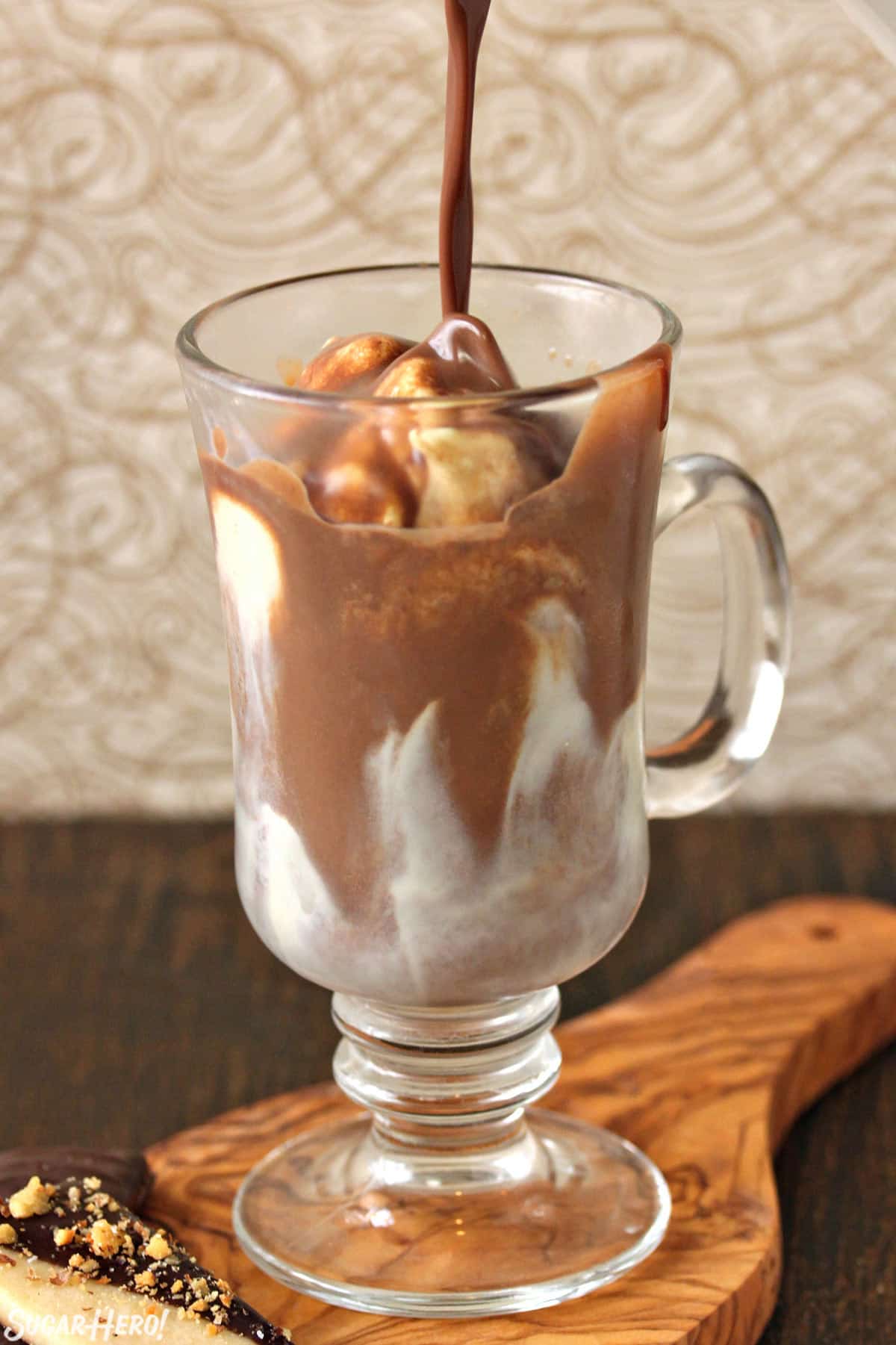 Pouring hot chocolate into a Hot Chocolate Float.